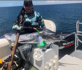 Wow Jeff! what a beautiful kill sitting in the back of a boat holding a massive catch and also holding the mutiny tf throw flasher.